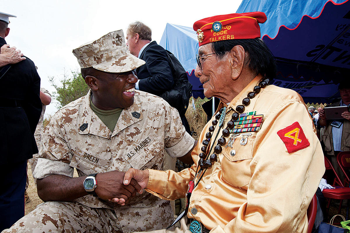 Marine Corps Sgt. Major Ronald L. Green (left) greeted Navajo code talker Samuel T. Holiday