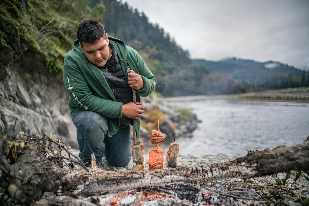 Sammy Gensaw preparing salmon for smoking