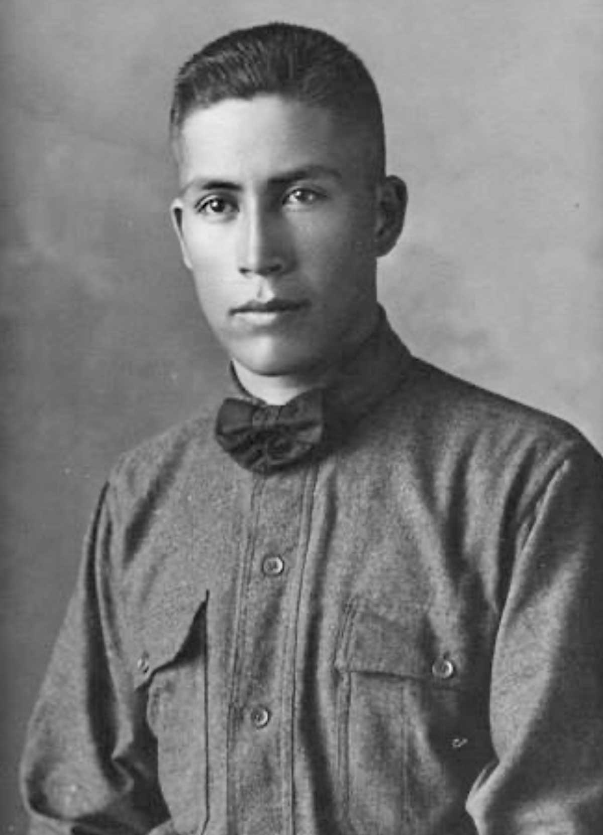 Black and white studio portrait of Private Albert Grass (Standing Rock Lakota) 