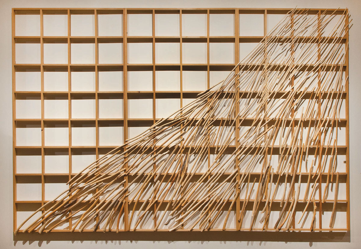 Willow saplings depicting flowing water against a geometric grid.