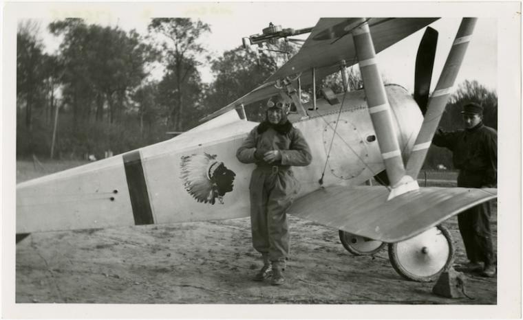 Robert Soubiran stands beside a Nieuport Type 17 pursuit plane, ca. 1917