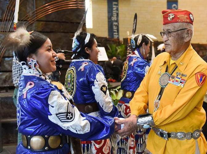 Navajo Code Talker Thomas Begay greets the Native American Women Warriors