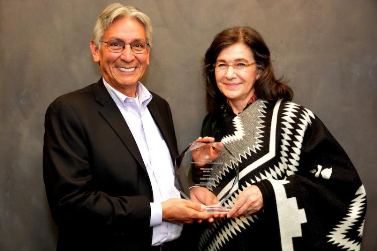 Louise Erdrich receiving the NMAI Award for the Arts from Director Kevin Gover