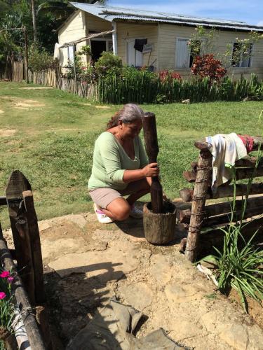 Nazaria Ramírez, from La Rancheria community, pounding mint tea