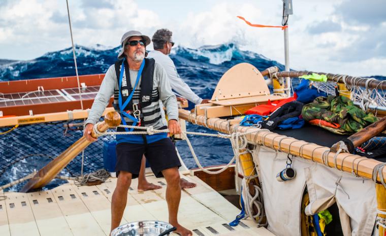 Dr. Craig Thomas at the helm of Hōkūle‘a