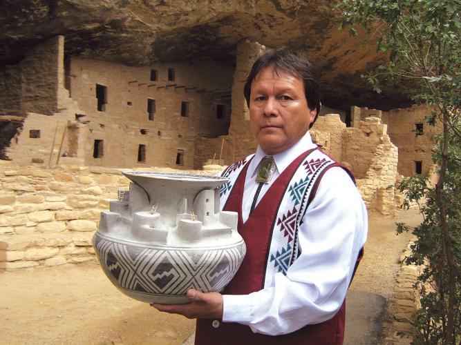 Joshua Madalena with Best of Show replica pottery of Cliff Palace. 2010, 14" x 18"