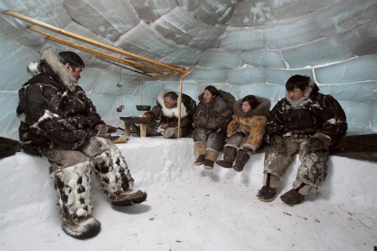 Nunavimmiut people of Canada re-enact life in an iglu