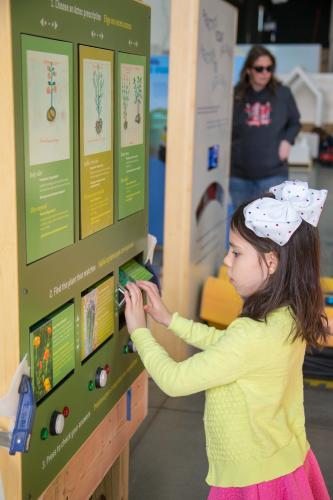 A student explores the Decode the Codex interactive statio