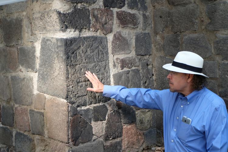 David Carrasco points to the face of the Aztec God of Rain