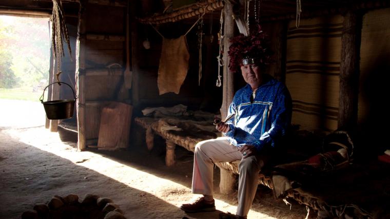 G. Peter Jemison in a Seneca longhouse