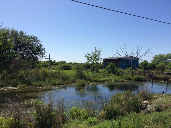 Cemetary with white cross.