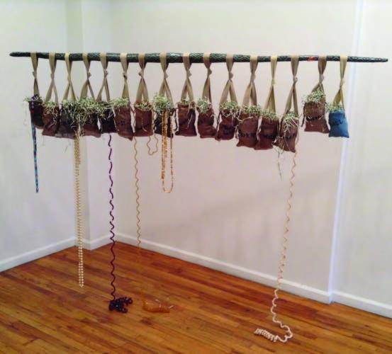 Hanging Out on Iroquois and Algonquin Trails, mixed media, wood, fabric and money 2015