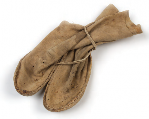 White Mountain Apache moccasins, 1919. Arizona. Deer hide, cow hide, sinew. 9/4086.