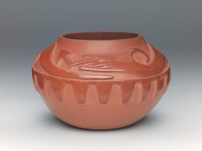 Red ware bowl with water serpent Awanyu (or Avanyu) carved into it