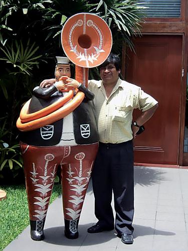 Ceramicist Gedion Fernandez with sculpture.