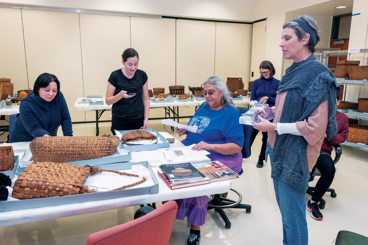 Kelly McHugh talking with researchers