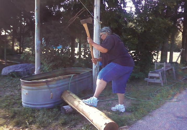 Renee Wasson Dillard pounding black ash log