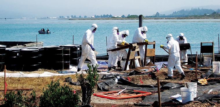 People cleaning the island in protective suits