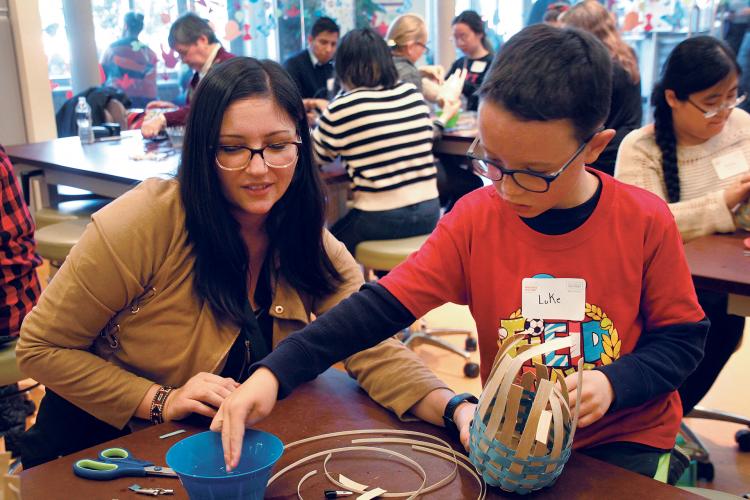 Parrish teaching how to weave a black ash basket