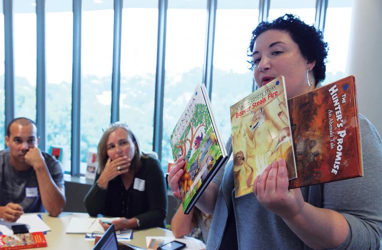 Sarah Shear sharing resources with educators during an NMAI teacher workshop