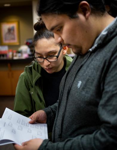 Michael Irvine and Leah Nelson look at their daughter Nizhóní Irvine’s paternal family tree