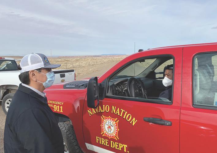 Navajo Nation President Jonathan Nez speaks with Fire Department Lieutenant Randy Frank