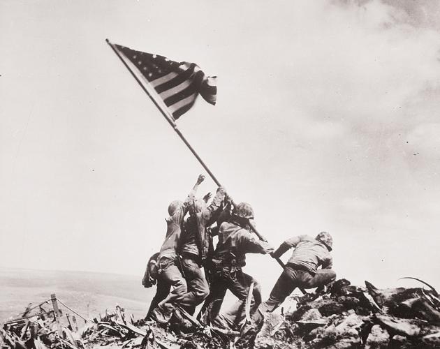 Corporal Ira Hamilton Hayes (Pima) helping raise American flag at Iwo Jima