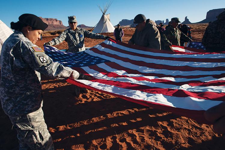 Members of the Oljato and Kayenta Veterans Associations refold an American flag