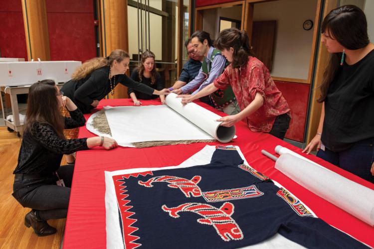 Curators prepare Tlingit robes to be returned to Tlingit clans in Alaska