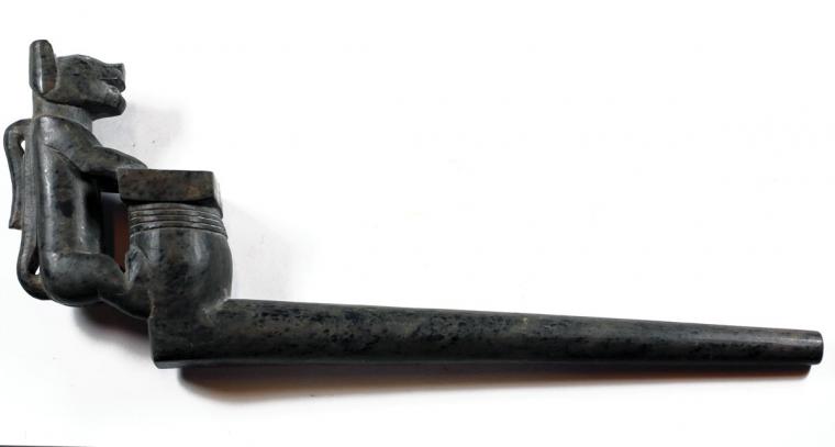 A black funerary pipe