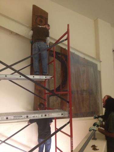 The Dog Salmon Screen being dislodged from the wall at NMAI's Cultural Resources Center in Maryland.