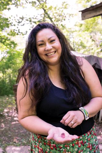 Tawnya Brant holds out a red Boletus mushroom