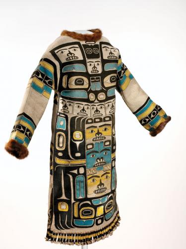 A tunic with blue and black designs and fur trim
