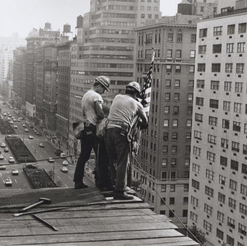 Kahnawake Mohawk ironworkers Jay Jacobs and Sparky Rice place a flag on a building in Midtown Manhattan