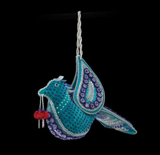 A Tuscarora beaded satin bag in the shape of a blue bird