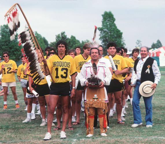 Iroquois Nationals co-founder Oren Lyons (Onondaga) walks with his team in Whittier Narrows Recreation Area in Los Angeles, California.