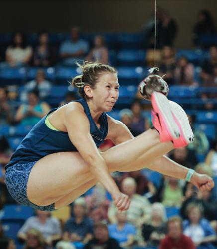 Amber Vaska kicks a hanging ball with both feet