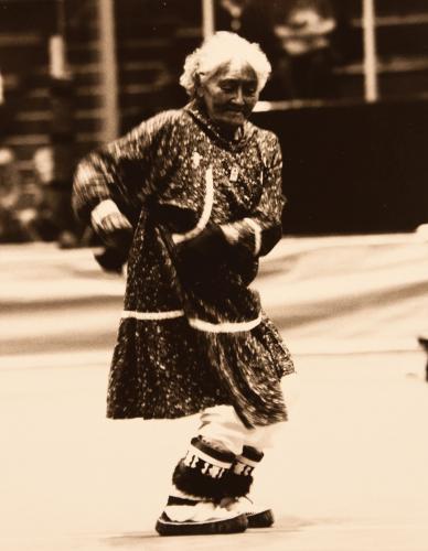 An Alaska Native elder performs a traditional dance