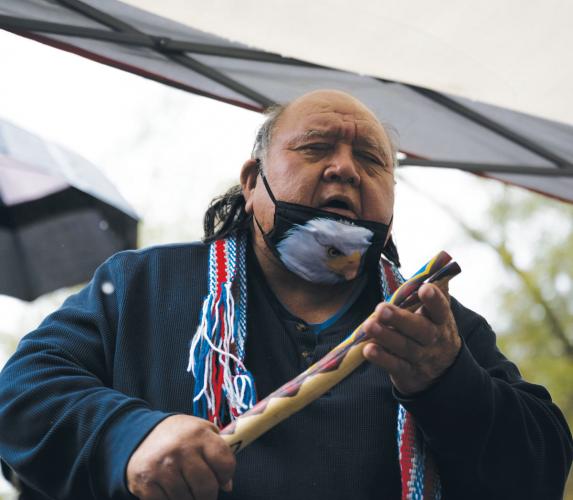 Ron Goode sings, keeping time with a clapper