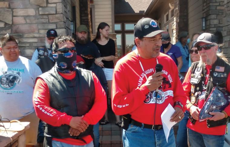 Bobby Martin and Mike Camarillo Sr. reading the names of fallen veterans