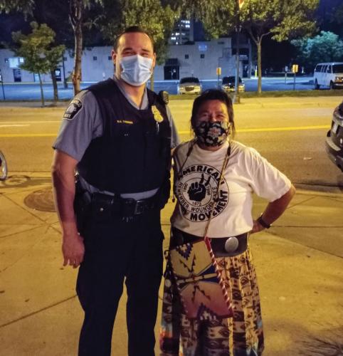 Minneapolis Police Officer Robb Thunder of the Red Lake Ojibwe Nation stands with Lisa Bellanger 