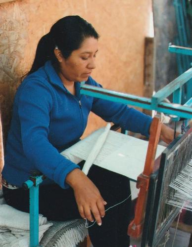 Aymara weaver Alejandra Challapa Castro works on one of her textiles in Chile.