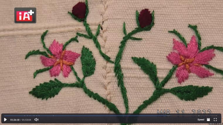 Detail of finely embroidered flower on a Zapotec women's blouse.