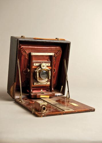Jennie Cobb's brown camera box sits open, angled on a studio backdrop