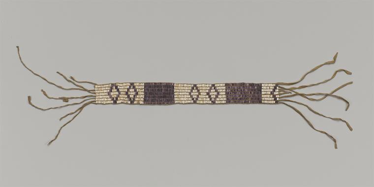 A beaded belt woven with symbols