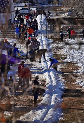 People form a track out of snow.