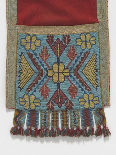 A beaded pattern and fringe adorns a Anishinaabe bandolier bag.