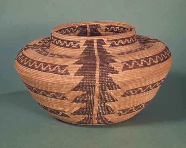 A woven tan and brown basket