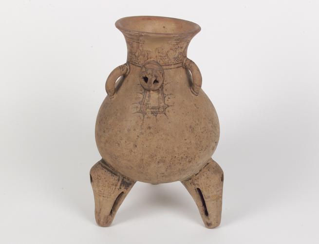 A tripod clay vessel