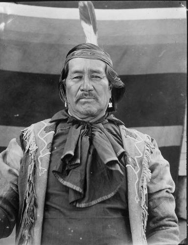 Black and white portrait of Joe Billy wearing a deer-skin coat